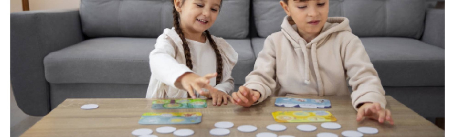 a boy and a girl playing with games and toys on children's development