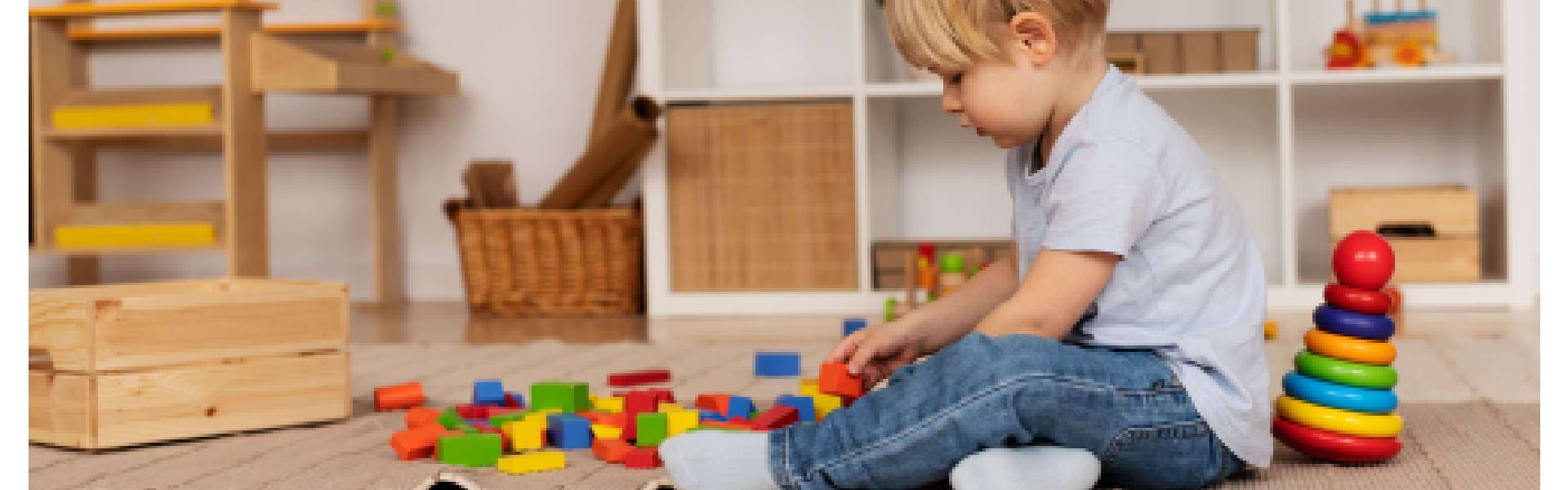a-boy-playing-with-kids-building-block-and-other-indoor-toys
