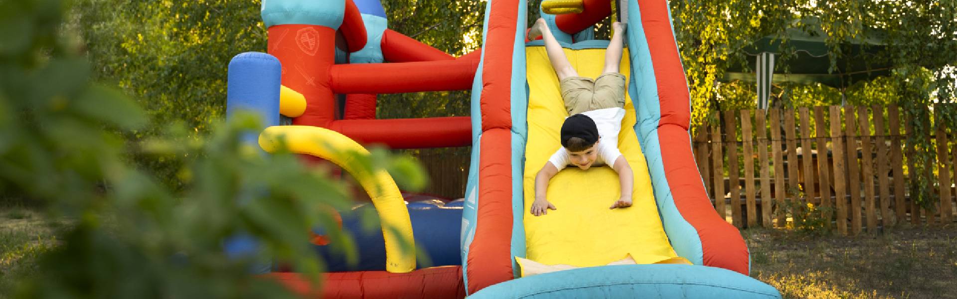 kid-playing-in-bounce-house-in-outdoor